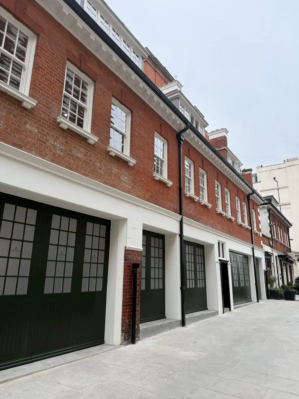 A Grade II listed red-brick mews terrace on North Row, Marble Arch, with sash windows