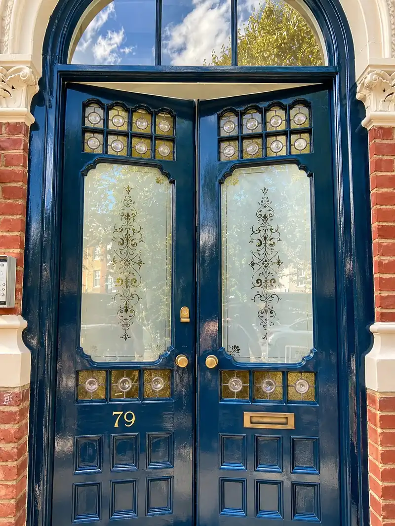 Victorian double front doors with etched and leaded glass, repaired and repainted in gloss navy